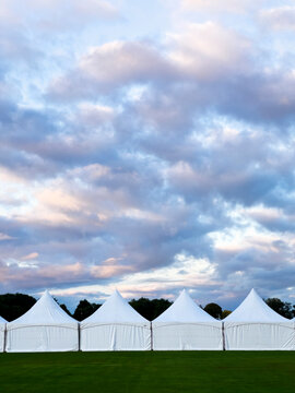 Tents lined up on field