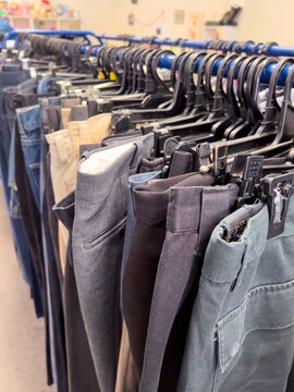 Secondhand trousers in charity shop