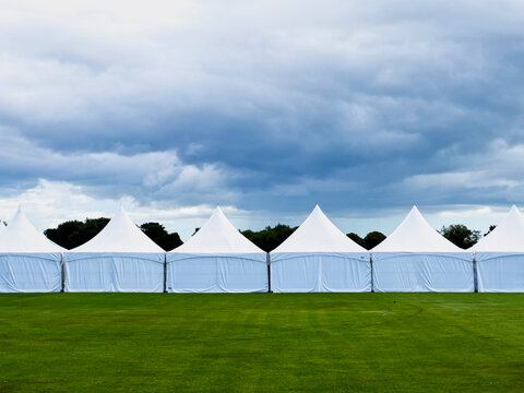 Tents lined up on field