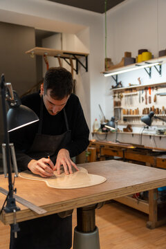 Luthier, Guitar Maker, Working In The Workshop. 