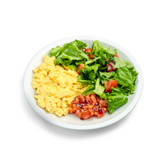 Scramble with fish and a salad of fresh vegetables and lettuce. Breakfast in a cafe. Isolated object on a white background.
