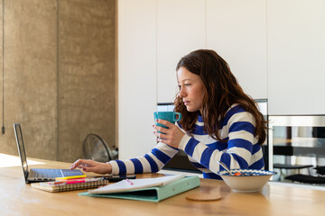 woman using laptop to study 