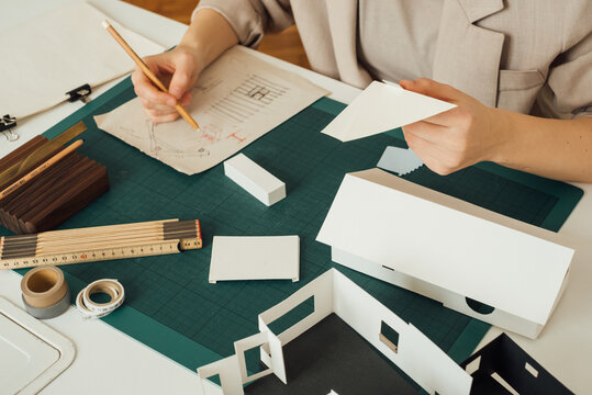 Architect Sketching on a Piece of Paper