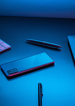 scattered office items on desk