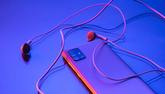 Detail on mobile and earphones.