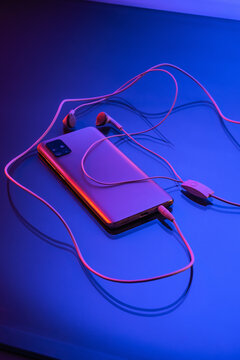 cellphone and earphones holographic detail 