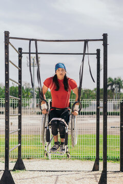 Man in wheelchair exercising.