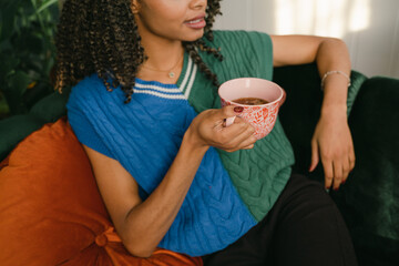 anonymous hands of  woman drinking tea