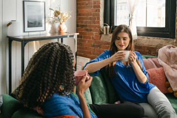 friends chatting and relaxing with afternoon tea