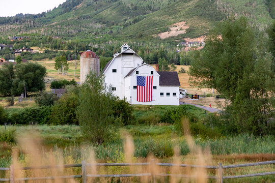 Park City Utah farm barn  landscape with American Flag 