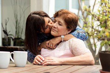 Mother Enjoys A Kiss From Her Daughter