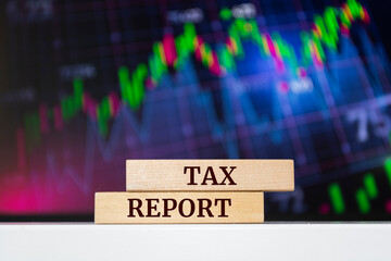 Wooden blocks with words 'Tax Report'. Business concept