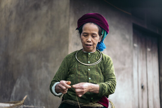 Hmong woman weaving in a workshop in the countryside in Ha Giang