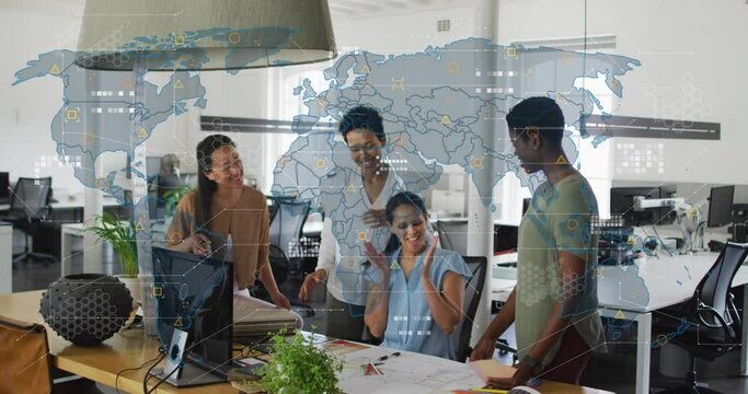 Animation of world map against diverse colleagues clapping and high fiving each other at office