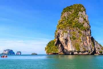 Fototapeta premium Huge cliff rock in azure water, Ko Rang Nok, Ao Phra Nang Beach, Ao Nang, Krabi, Thailand