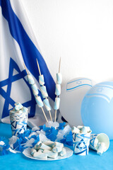 Birthday cake with candles in the form of the number 75 In blue and white colors, Concept of the Israeli holiday Independence Day
