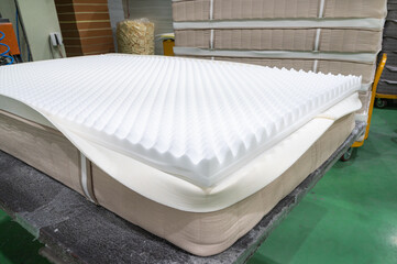 Fototapeta na wymiar interior view of the mattress. white sponge close-up material.