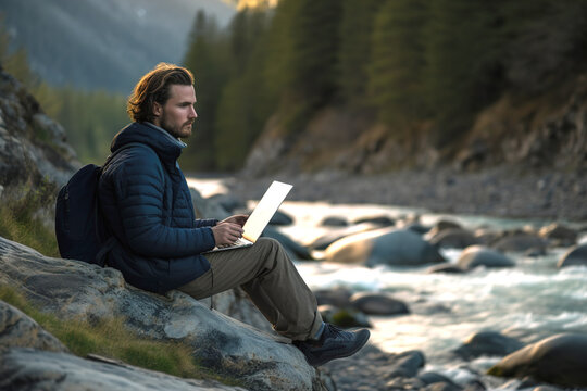 A man hiker with backpack chatting online on laptop during sitting in by the river on nature. Generative ai