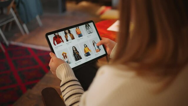 Fashionable Finds: Woman Discovers New Clothes via Tablet