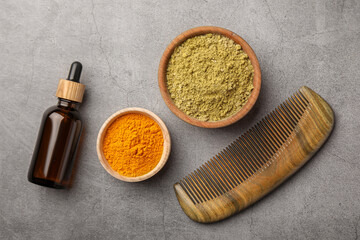 Flat lay composition with henna and turmeric powder on light grey table. Natural hair coloring