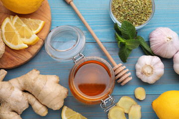Cold remedies on light blue wooden table, flat lay. Cough treatment