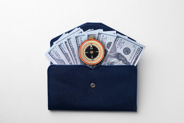 Exchange rate. Wallet with money (dollar banknotes) and compass on white background, top view