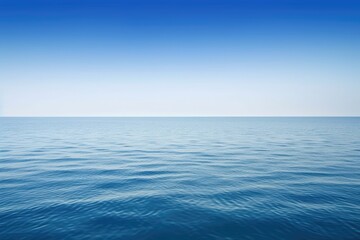 Fototapeta na wymiar serene blue lake surrounded by mountains under a clear blue sky. Generative AI