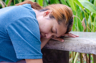 Asian women experiencing dizzy or fainting