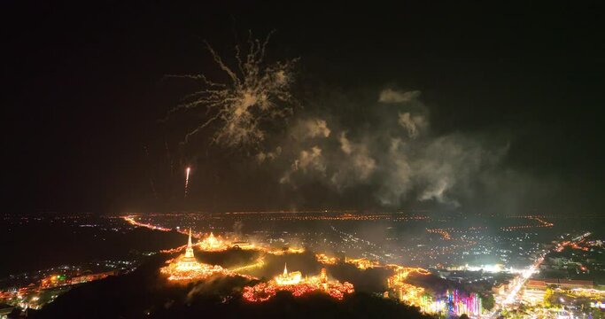aerial view Stunning fireworks over the hilltop palace in the heart of Phetchaburi, Thailand. .Fireworks dazzling. Annual Festival of City Lights and Fireworks.decorative lights background.