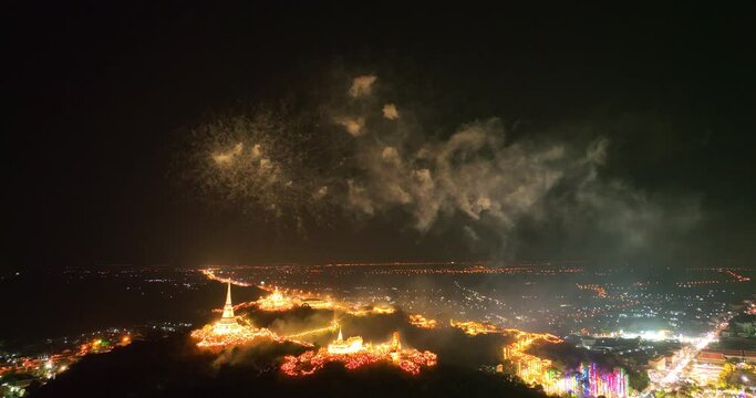 aerial view Stunning fireworks over the hilltop palace in the heart of Phetchaburi, Thailand. .Fireworks dazzling. Annual Festival of City Lights and Fireworks.decorative lights background.