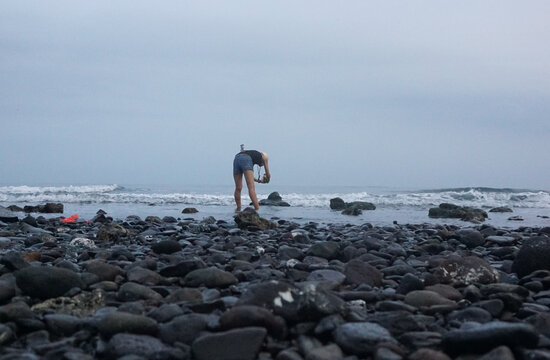 People enjoy clody morning at Lovina beach, bali, Indonesia.
