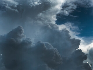 Dark thunderstorm clouds rainny landscape. Meteorology danger windstorm disaster climate. Dramatic dark storm thundercloud rain clouds on black sky background.Dark cloudscape storm disaster gray sky