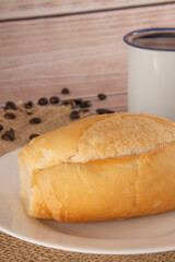 French Bread on Plate with Coffee Mug and Bread Basket in Background, Close-Up Shot, Breakfast, Vertical