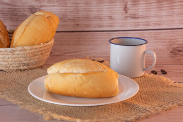 French Bread on Plate with Coffee Mug and Bread Basket in Background, Close-Up Shot, Breakfast