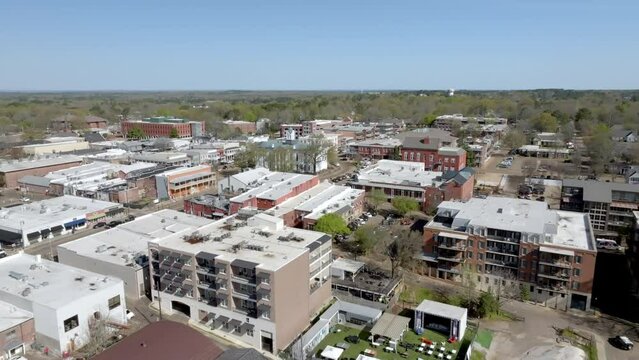 Downtown Oxford, Mississippi skyline with drone video moving low and forward.