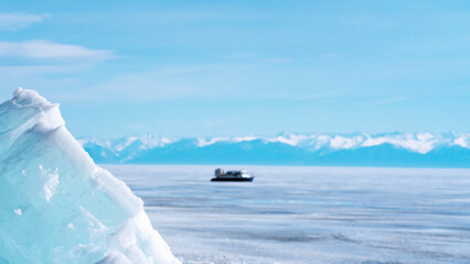 Hovercrafts on Lake Baikal. Airboat, winter transport extreme. Hovercraft sliding fast on the surface of the transparent frozen Lake. Baikal ice. 