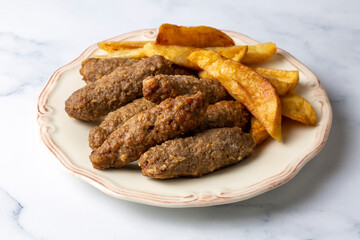 Traditional Turkish food; dry meatballs or inegöl meatballs with potatoes (Turkish name; Kuru kofte or anne koftesi)