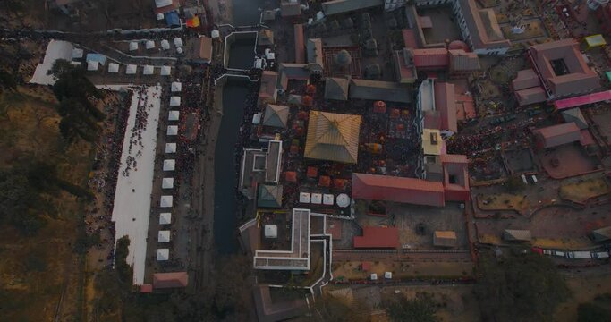 Aerial drone footage showcases the stunning Pashupatinath temple in Kathmandu during the golden hour before sunset on Shivaratri. The beautiful scenery and atmosphere are captured in this video.