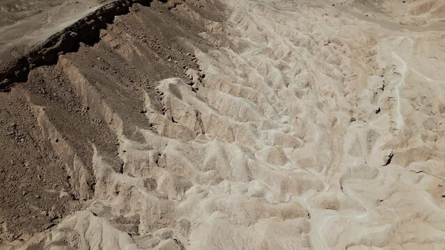 Experience Atacama's magnificent rock formations like never before, as breathtaking drone footage captures the rugged desert terrain from above, showcasing its awe-inspiring beauty.