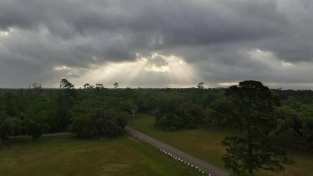 Sun rays on a cloudy day over Fontainebleau State Park in Mandeville Alabama