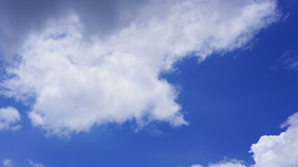 Clear blue sky and white clouds.