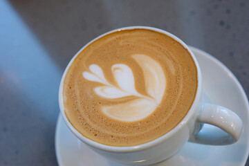 cup of coffee with tree pattern in a white cup Cappuccino coffee cup with latte art isolated. High quality photo