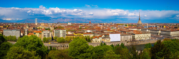 Fototapeta na wymiar Torino city skyline with the view of Mole Antonelliana over the Po River and Ginzburg Park, a view from Church of Santa Maria del Monte dei Cappucciniin Turin, northern Italy