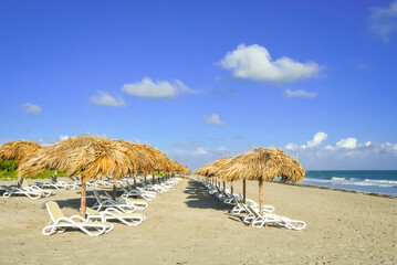 Beach with umbrella and chairs