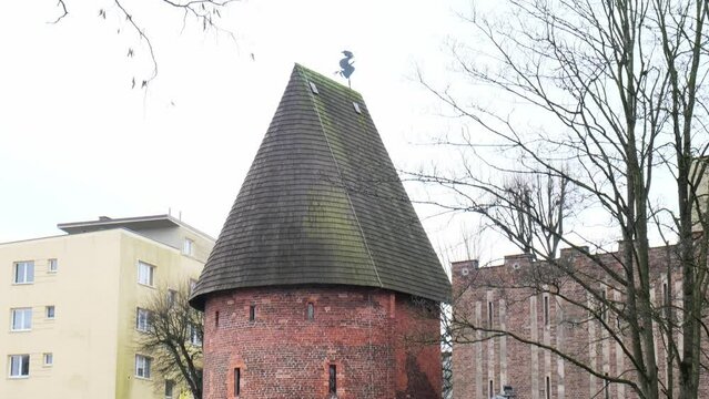 Round tower in the historic surrounding city wall of Slupsk, Poland. Witches tower - Baszta Czarownic in Slupsk. Sights of Poland. Old jail. Travel destination. Tourist attraction 