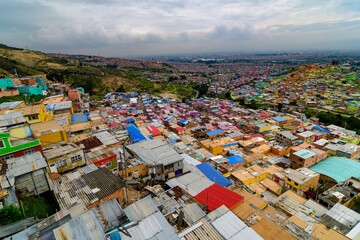 anoramic overview of a shanty town in the district ciudad bolivar in bogota, colombia - obrazy, fototapety, plakaty