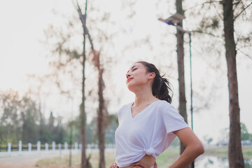 A concept of smiling female happy with life having inspiration, stretching, freedom, deep breath fresh air, positive, wellbeing, dreaming, euphoria, carefree, joy, spirit, celebrate life. Clam happy