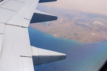 View from the window of a Flydubai plane flying over the territory of the countries of the Arabian...