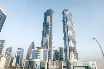 View from the window of a tourist bus on the JW Marriott Marquis Hotel Dubai and other architecture in Dubai city, United Arab Emirates