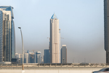 Naklejka premium View from the window of a tourist bus on the architecture in Dubai city, United Arab Emirates